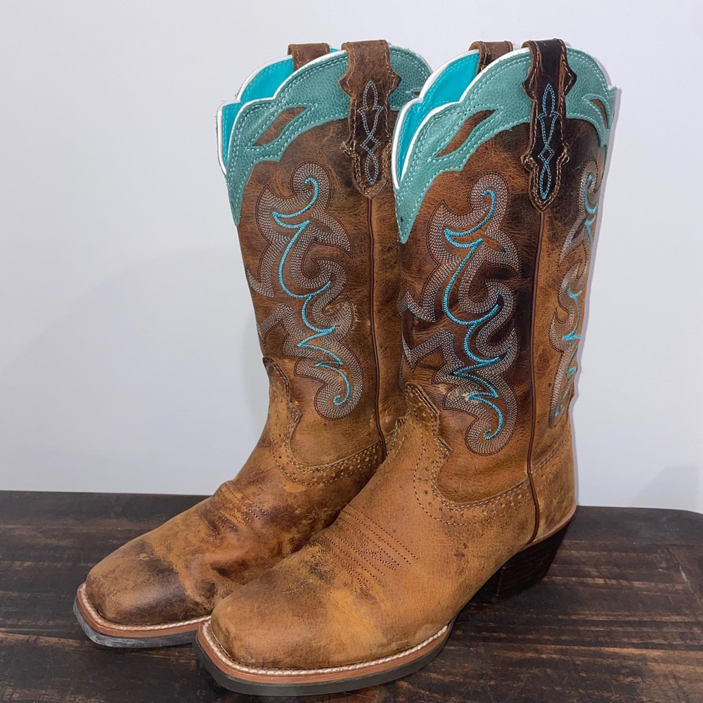 Justin Boots, been worn a couple times. Soles are like brand new!